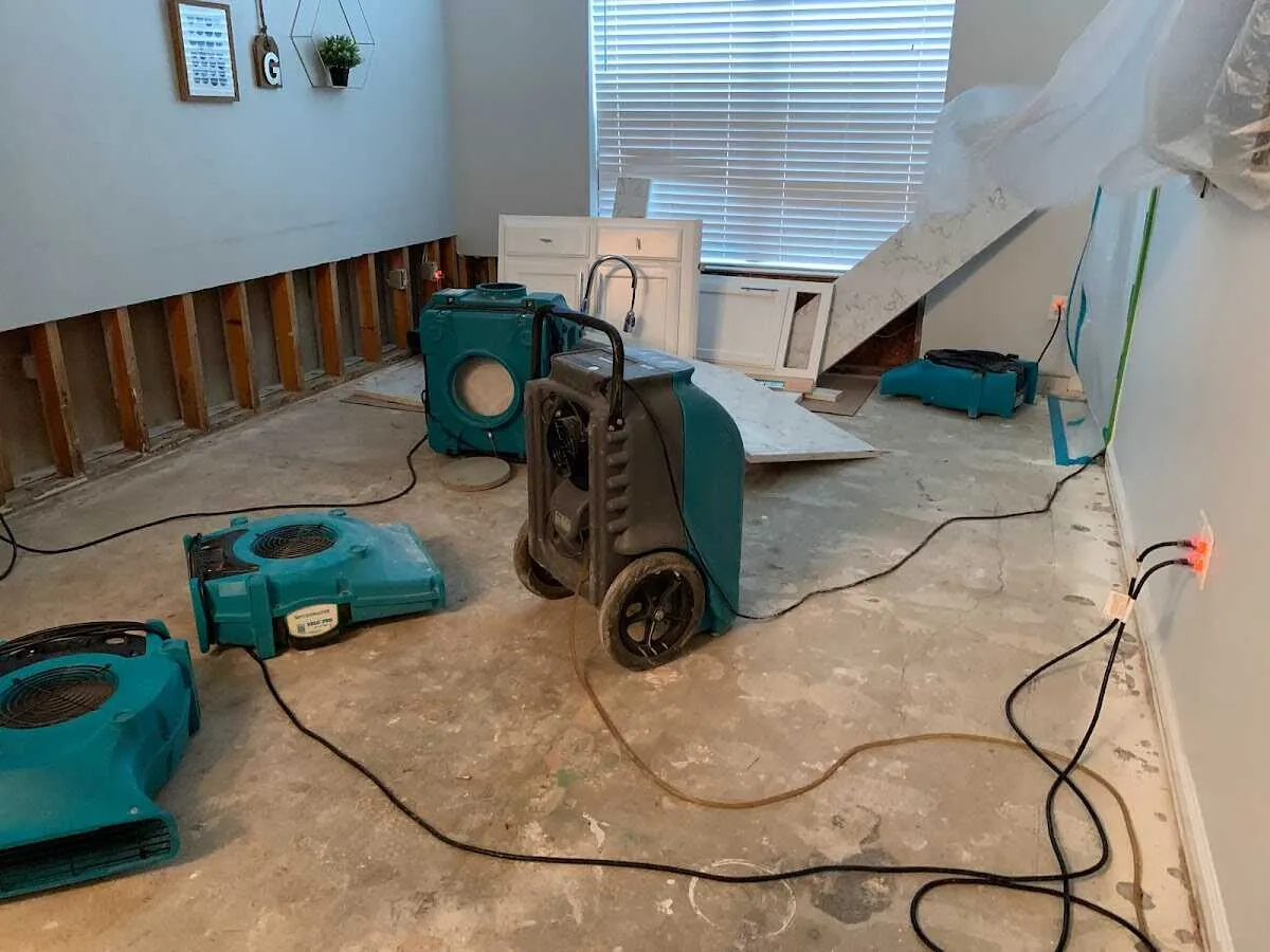 Dehumidifier in flood-cut room for Water Damage Restoration in Hampden