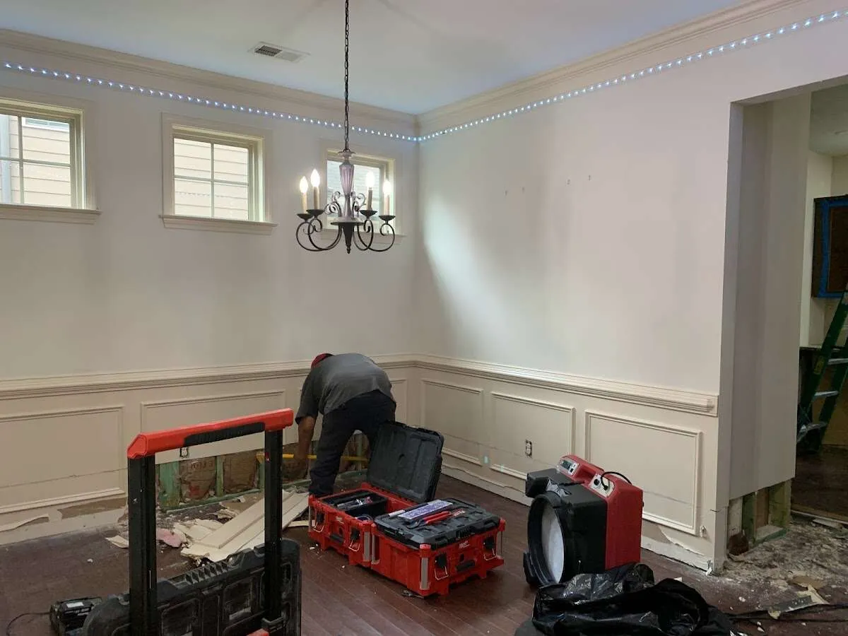 Restoration technician with professional equipment in Hampden